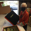 woman holding artists' book