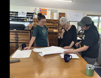 3 people at work in print shop