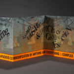 "The Necropolitics of Extraction" extended colorful accordion artists' book of prints and type