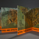 "The Necropolitics of Extraction" close-up colorful artists' book of prints and type