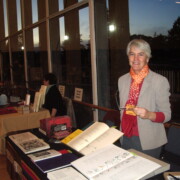 Woman with books on table