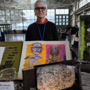 Woman with display of art books